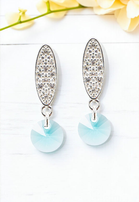 Aros Punto de Luz Baño de Oro Blanco y Cristales Genuinos Turquesa.