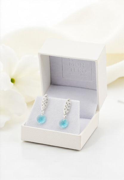 Aros Punto de Luz Baño de Oro Blanco y Cristales Genuinos Turquesa.