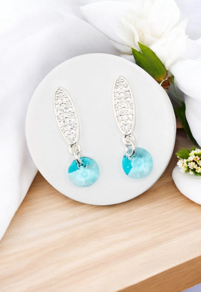 Aros Punto de Luz Baño de Oro Blanco y Cristales Genuinos Turquesa.